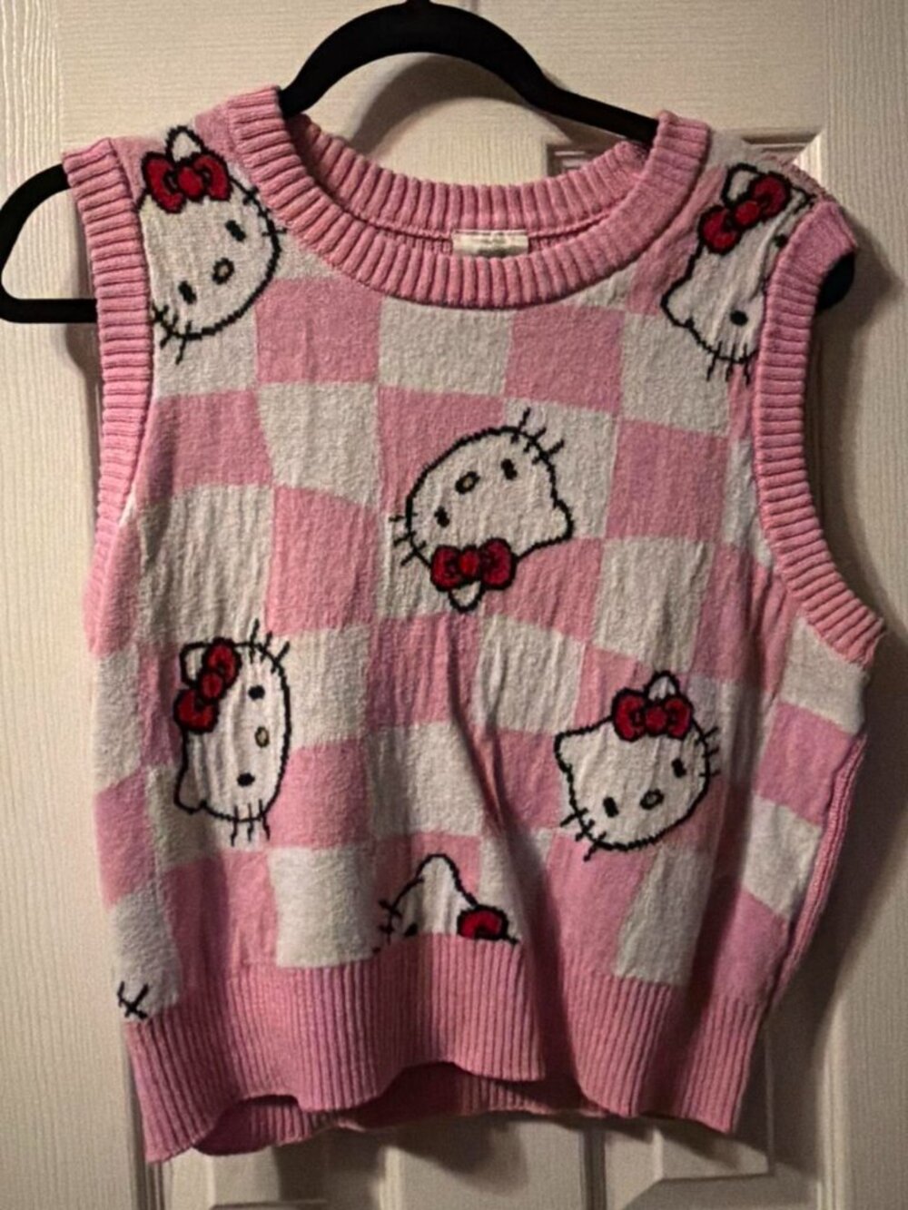 Hello Kitty pink and white sweater vest PLEASE NOTE The sweater has a tear that